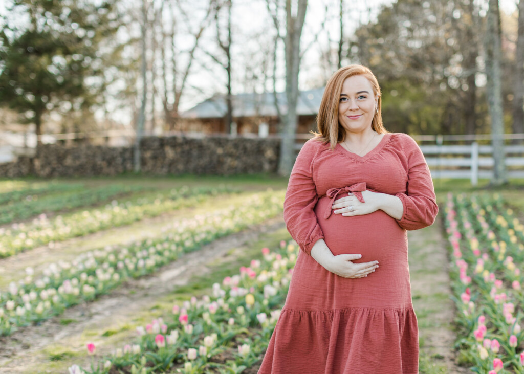 Maternity photos in the field of tulips at Dewberry Farm in Kernersville. Brooke Grogan Photography.