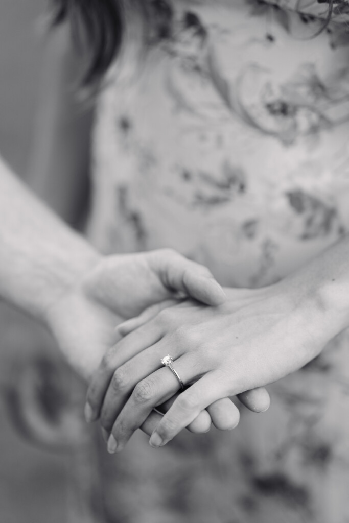 Engaged couple holding hands in Reynolda Gardens