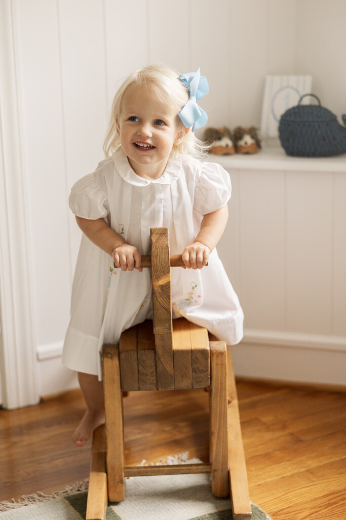 Little sister at newborn photo shoot in Winston Salem