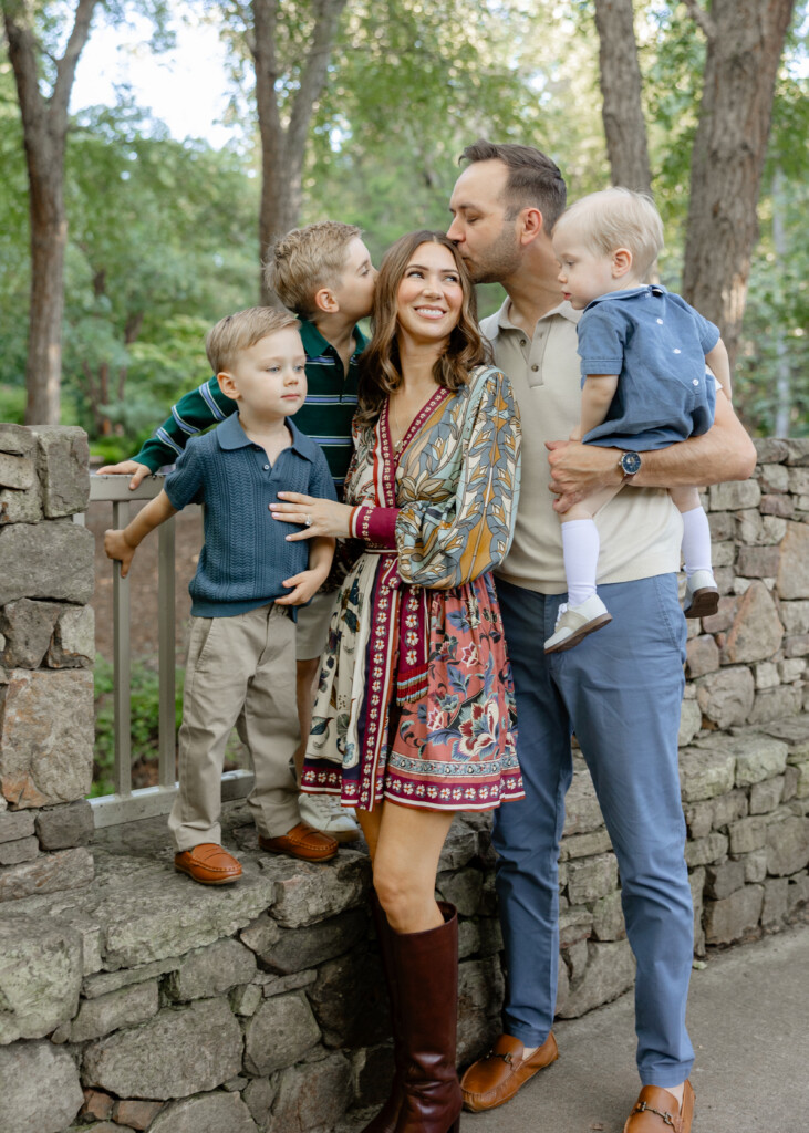 Greensboro NC photographer capturing a family laughing together during a fall photo session