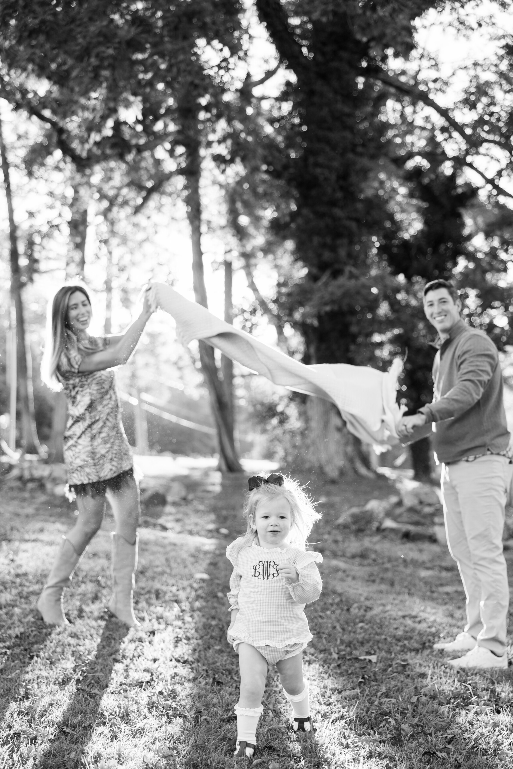 family laughing together during a Greensboro NC family photo session